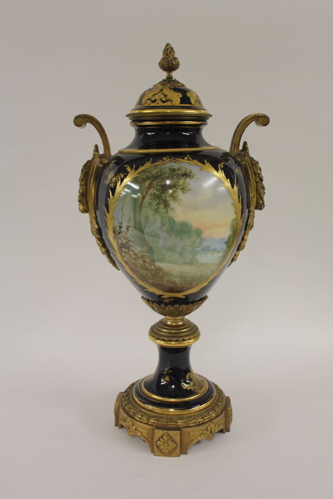 A large French porcelain vase and cover,c.1880, of inverted baluster form painted with an 18th - Image 2 of 2