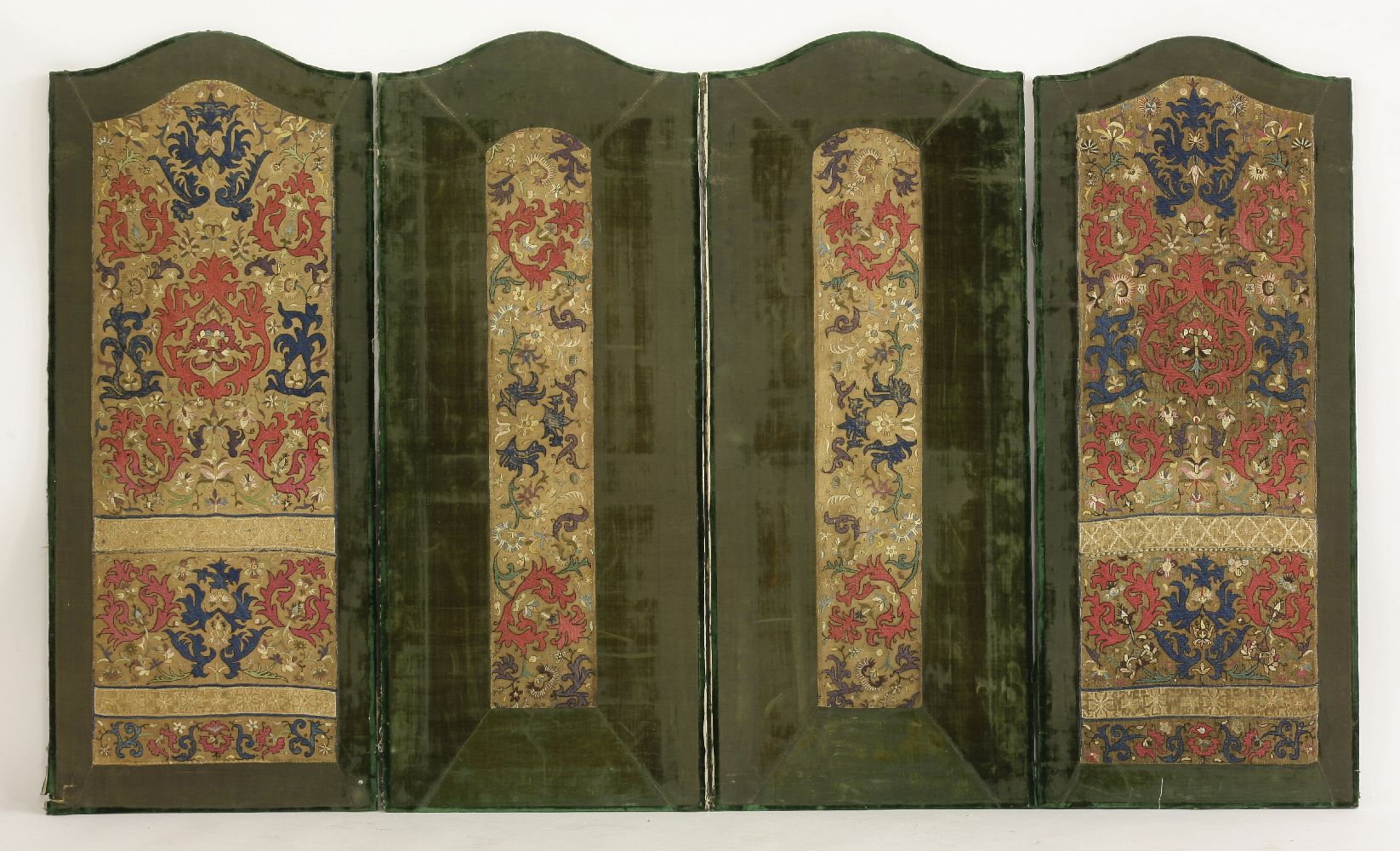 Four arched top embroidered panels,possibly Algerian, late 18th century, the centre of the four