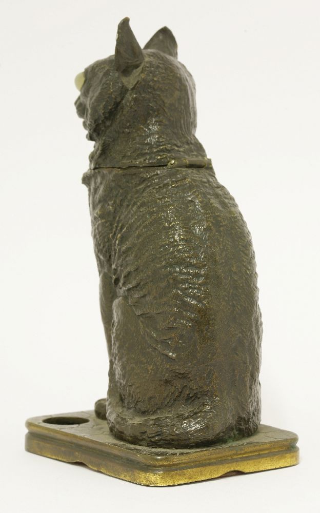 A bronze inkwell,late 19th century, modelled as a seated cat with hinged head and glass eyes,23cm - Image 2 of 3