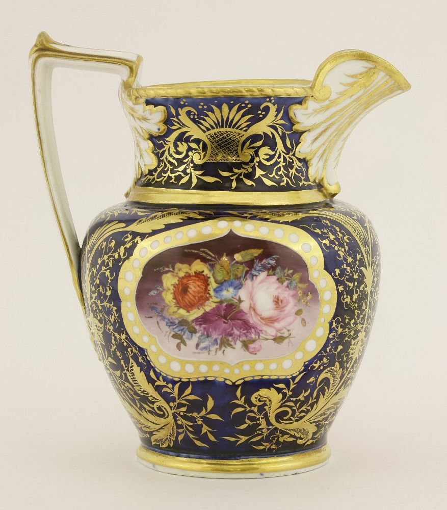 A Coalport hand-painted jug, c.1810, with panels of flowers within a shaped gilt cartouche against a - Image 2 of 3