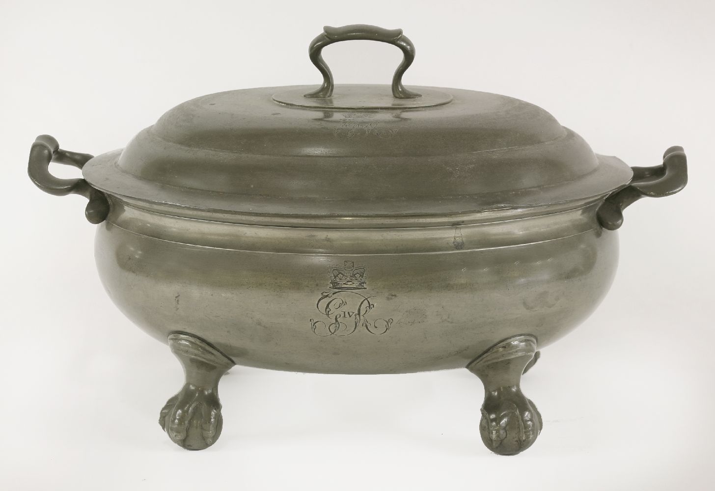 An oval pewter tureen and cover,made as part of the service for the Coronation Banquet at