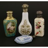 A group of four scent bottles, comprising:a blue and white Jasperware example with screw crown