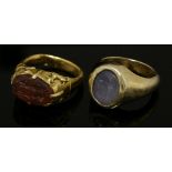 A high carat gold hardstone oval intaglio ring,intaglio engraved with two standing figures, claw set