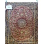 A red ground Keshan Rug, 1.90 x 1.