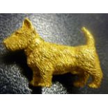 A heavy 9ct yellow gold brooch modelled as a Terrier, weight approx. 14.