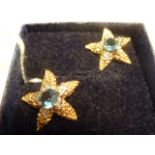 A pair of 14 carat yellow gold topaz and diamond set star shaped Earrings (Matches Lot 162)