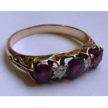 A ladies yellow metal (probably late 19th/early 20th Century) Ring set with three sizable rubies