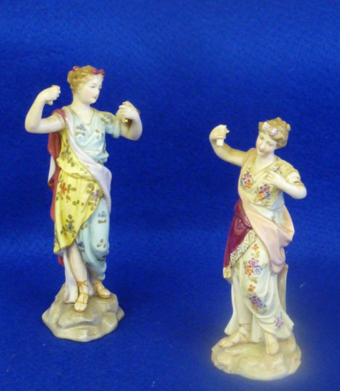 Two 19th Century hand decorated Continental porcelain female Figure Models, both with arms raised,