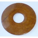 An archaic style hand tooled Chinese hardstone Bi disc,