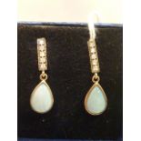 A pair of gold opal and diamond set drop Earrings