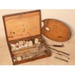 An early 20th Century mahogany Artist's Box, the hinged front opening to reveal removable trays,