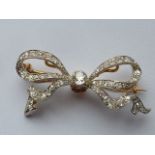 A beautiful and heavy diamond set Belle Epoch Brooch modelled as a bow (estimated total diamond