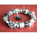 A ladies 'Pandora' style silver and glass bead Charm Bracelet,