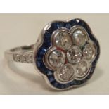 An 18 carat white gold diamond and sapphire flower head Cluster Ring