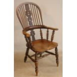 A mid 19th Century Windsor Armchair having shaped elm seat and bow,