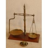 A large set of early 20th Century brass Scales together with various sized Weights,