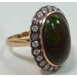 A fine 18 carat gold Ring set with large opalised Australian wood opal and diamonds