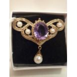 A Victorian gold Brooch set with large amethyst and pearls