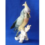 A porcelain Model of a Cockatoo perched on a blace de chine tree stump,