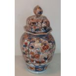 A 19th Century octagonal baluster hand decorated Imari porcelain Jar and Cover,