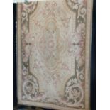 A French Aubusson style Tapestry, cream and green ground with foliate style designs etc.