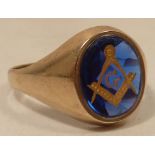 An unusual 9 carat gold Masonic Ring centrally set with a dark blue stone of good colour
