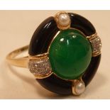 An 18 carat gold designer Ring set with onyx, jade,