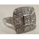 An 18 carat white gold diamond Cluster Ring set with princess cut diamond and brilliant cut