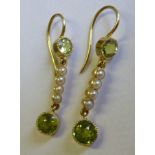A stylish pair of ladies see pearl and peridot drop Earrings