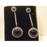 A pair of onyx and diamond drop Earrings