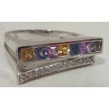 An 18 carat white gold Ring set with a row of diamonds and a row of coloured sapphires