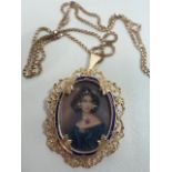 A fine 18 carat gold filigree cased Portrait set with diamonds and ruby on a 9 carat Chain