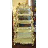 A good early 20th Century original Swedish pine carved and gilded five tier mirror backed waterfall