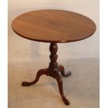 A George III period circular oak tilt-top Occasional Table,