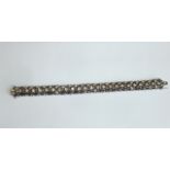 A ladies fine white metal Bracelet designed as a series of scrolling fancy links,