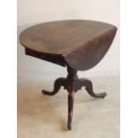 An unusual early George III period circular drop leaf Occasional Table,