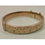 A 9 carat gold engraved decorated Bangle