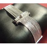 An 18 carat white gold seven strand Bracelet set with 40 diamonds