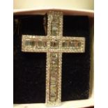 A superb 18 carat white gold Cross set with baguette diamonds and brilliant cut diamonds