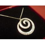 An 18 carat gold multi diamond set swirl Pendant and Chain