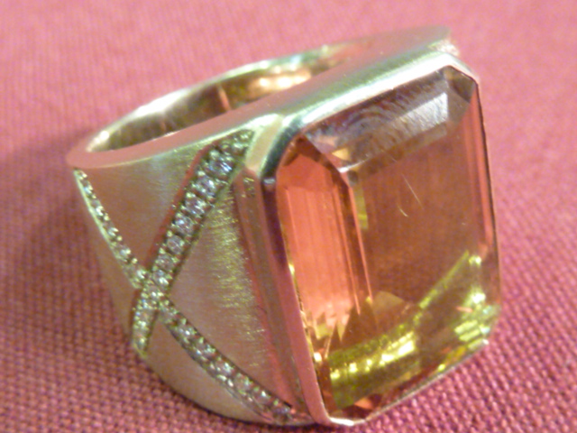 A very heavy (25gr) 18 carat gold Imperial topaz and diamond Ring CONDITION REPORT: