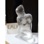 A modern boxed Lalique frosted glass Sculpture, seated female nude, etched signature to underside,