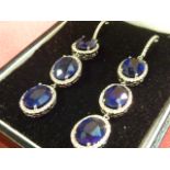 A pair of 18 carat gold Earrings consisting of six 2 carat sapphires set as sapphire and diamond