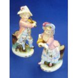 A pair of late 19th Century Continental hand decorated porcelain figural Spill Vases,