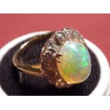 An 18 carat gold large opal and diamond cluster Ring