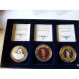 Three boxed silver gilt Commemorative's, the Coronation 50 Pence,