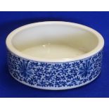 A Chinese circular porcelain Bowl hand decorated in underglaze blue with scrolling lotus (probably