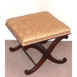 A Regency period mahogany cross frame Stool having a later upholstered damask style top (damage)