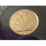 Queen Elizabeth II 2014 gold Sovereign within perspex case