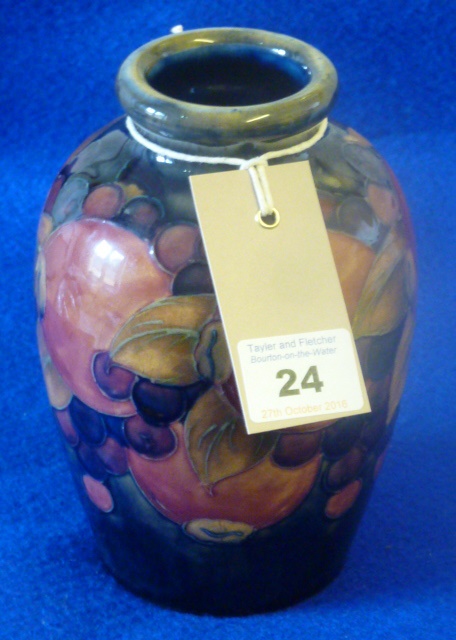 A Moorcroft pottery Vase tube lined and decorated in the pomegranate pattern,